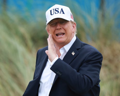 Donald Trump, wearing a USA baseball cap, on a golf course in Ireland.