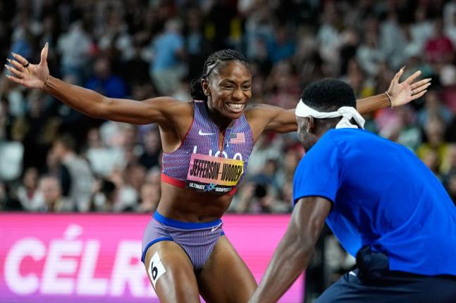 Melissa Jefferson-Wooden, of the United States, celebrates with sprinter Kenneth Bednarek, also of the United States, after winning the women’s 200 metres final at the World Athletics Ultimate Championship in Budapest, Hungary, yesterday,