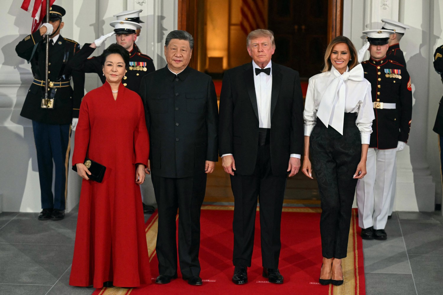 China's First Lady Peng Liyuan, left, China's leader Xi Jinping, U.S. President Donald Trump and U.S. First Lady Melania Trump pose on the North Portico steps of the White House ahead of a State Dinner in Washington, DC, on September 24, 2026.
