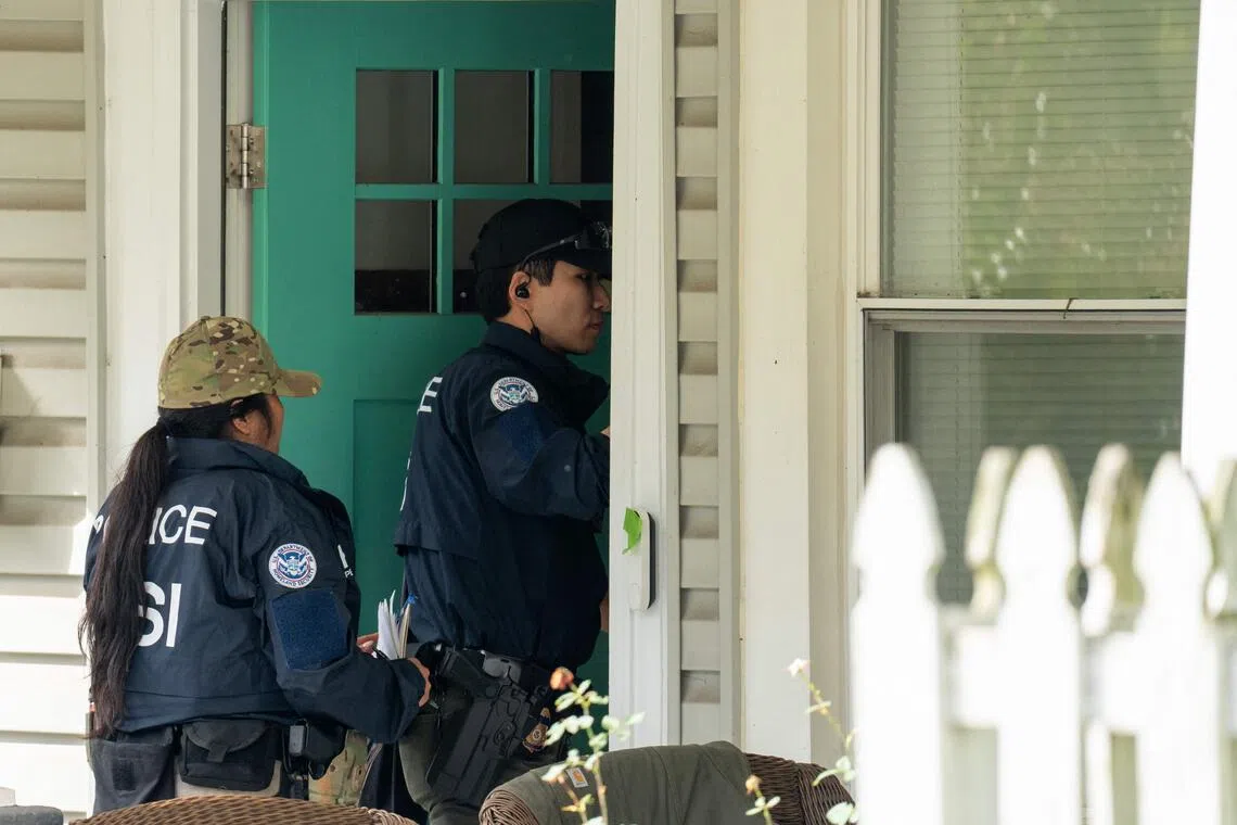 Homeland security personnel search the home of Ilhan Omar on Oct 12.