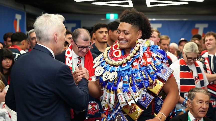 A man celebrates winning an NRL premiership